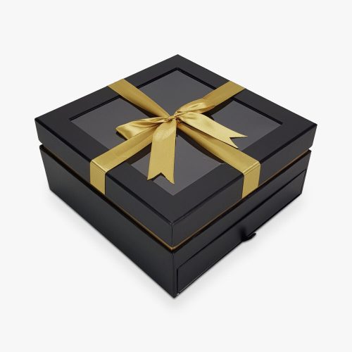 Würfelbox mit goldenen Schubladen, schwarz